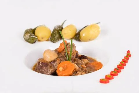 Close up of a tempting beef stew with an assortment of vegetables. Traditiona Stock Photos