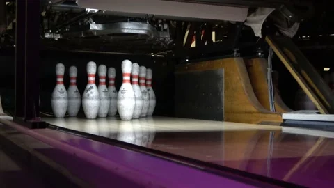 Close up of ten bowling pins doing a strike Stock Footage