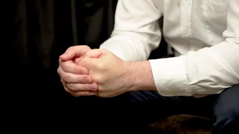 Close up Tense nervous man hitting fist into palm. Anxious male striking fist Stock Footage 306482855