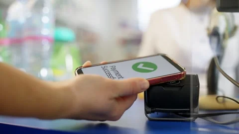 A close-up of the terminal to which the phone is brought up. Stock Footage 277999849