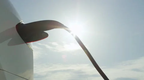 CLOSE UP: Tesla autonomous car plugged in for battery filling under sunny sky Stock Footage 67223742