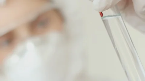 Close-up of a test tube with a solution in which blood is dripped for analysis Stock Footage 124481416