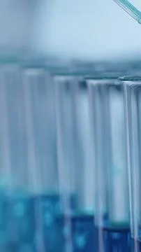 Close-up of test tubes with blue liquid in a laboratory Stock-Fotos