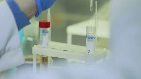 Close-up of test tubes on hand research Stock Footage 75258434