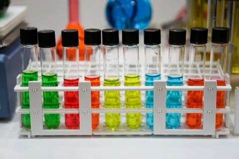 Close up of test tubes with multicolored solution	 Stock Photos