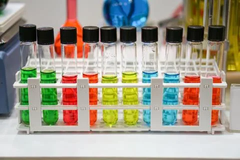 Close up of test tubes with multicolored solution	 Stock Photos
