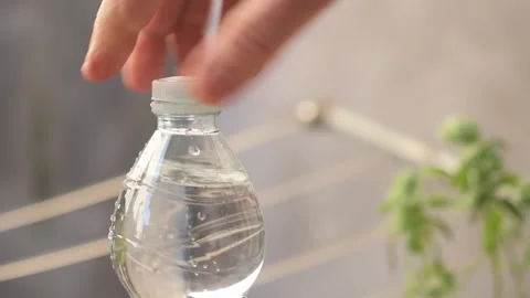 Close-up of a Tethered Plastic Cap – Eco-Friendly Bottle Design under EU Law Stock Footage 318715982