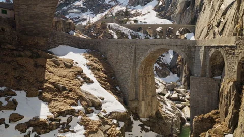 Close-up of Teufelsbrücke Devil's Bridge historic stone arch above rocky gorge Stock Footage 333988289