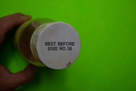 Close up text Best Before Date on Bottle Cap Food Stock Photos