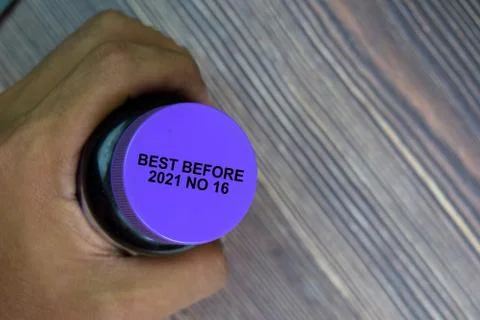 Close up text Best Before Date on Bottle Cap Food Stock Photos