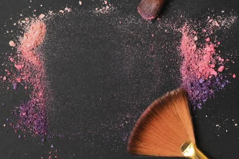 Close up. text frame with makeup brushes on black background Stock Photos