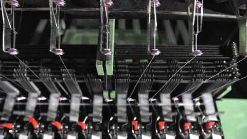 Close up of textile machine in slow motion. Fibre thread lines on the weaving Stock Footage 220928074