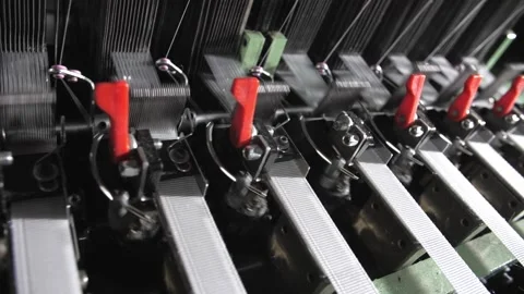 Close up of textile machine in slow motion. Fibre thread lines on the weaving Stock Footage 220928214