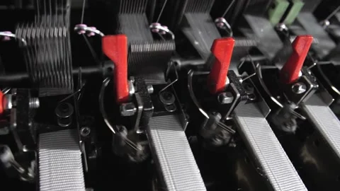 Close up of textile machine in slow motion. Fibre thread lines on the weaving Stock Footage 220928298