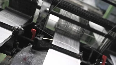Close up of textile machine in slow motion. Fibre thread lines on the weaving Stock Footage 220929049