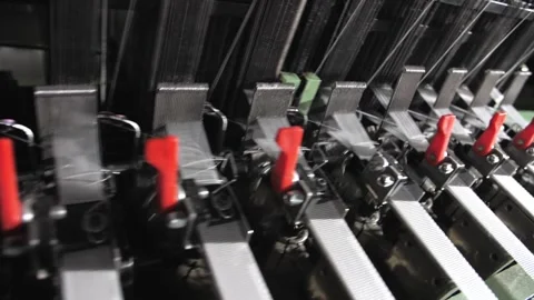 Close up of textile machine in slow motion. Fibre thread lines on the weaving Stock Footage 221179246