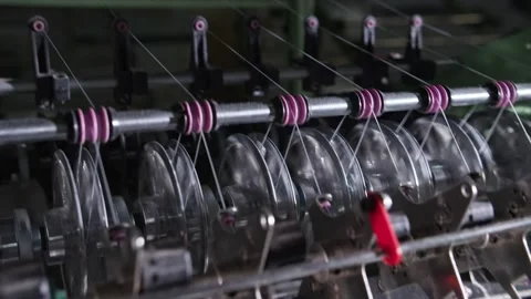 Close up of textile machine in slow motion. Fibre thread lines on the weaving Video stock 221179377