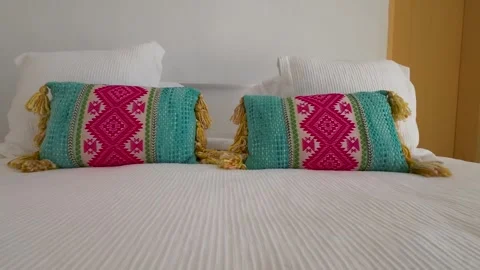 Close up of textiles used in decorating the room, pillows and duvet. Texture 스톡 동영상 293289537