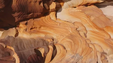 Close up texture of abstract wave pattern on sandstone geological rock layer Stock Footage 340749707