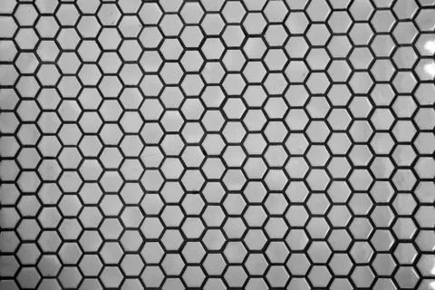 Close up texture and surface of Hexagonal white mosaic floor and wall tiles Foto stock