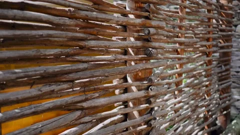 Close-up of texture background of woven vine handmade. Wooden fence. Video stock 151082008