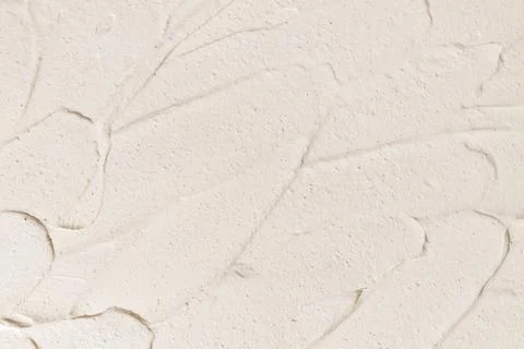 Close-up texture of beige moisturizing cream. Skin care product background. Stock Photos