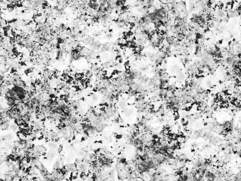 A close-up of a texture of black-and-white polished granite stone surface Stock Photos