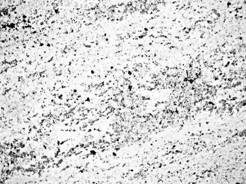 A close-up of a texture of black-and-white polished granite stone surface Stock Photos