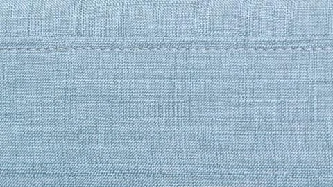 Close-up texture of Blue linen fabric with seam Stock Photos