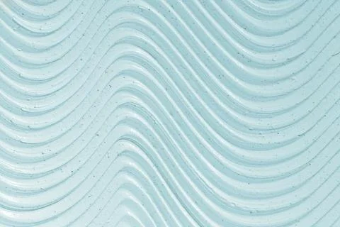 Close-up texture of blue moisturizing cream. Skin care product background. Stock Photos