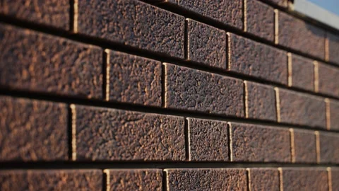 Close-up of texture of brick wall. Siding made of plastic imitation of stone Stock Footage 166840196