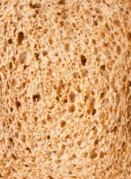 Close up texture of brown rye bread macro detail food Stock Photos