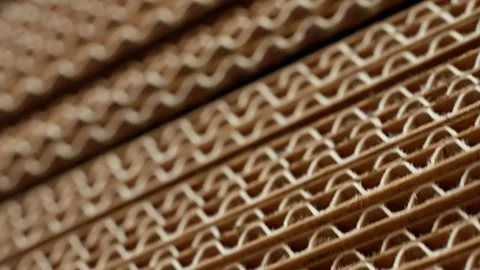 Close Texture of Corrugated Cardboard Layers Revealing Wavy Paper Core Stock Footage 337438169