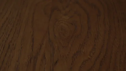 Close up texture of dark wooden table top with natural pattern. Part of the Stock Footage 303473065