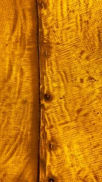 Close-up of the texture of a deep gold-coloured torn metal Stock Photos