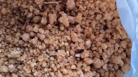 Close-up texture of dried granular processed cassava. 動画素材 327251323