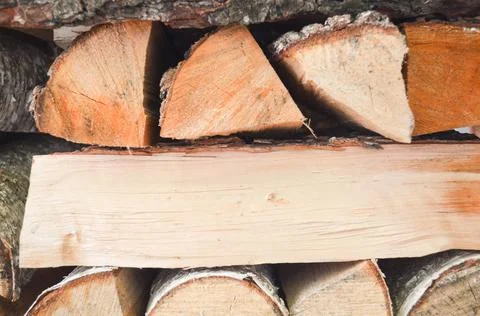 Close-up texture of dry fireplace logs. Wood background. Stock Photos