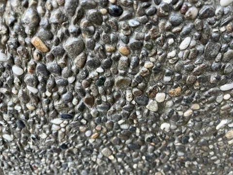 Close-up texture of exposed aggregate concrete surface Stock Photos