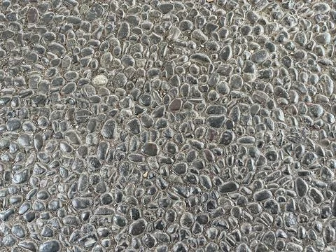 Close-up texture of exposed aggregate concrete surface Stock Photos