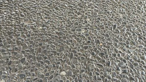 Close-up texture of exposed aggregate concrete surface Stock Photos