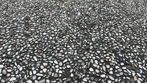 Close-up texture of exposed aggregate concrete surface Stock Photos