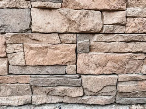 Close-up of texture of facing brick in gray and beige tones in the decoration Stock Photos