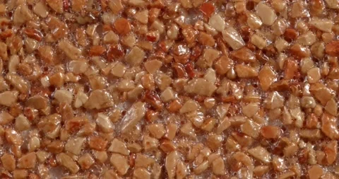 Close-up texture of fine marble chips. Amber color. Vidéo 167582742
