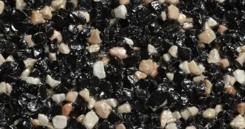 Close-up texture of fine marble chips. Black and white and beige color. Видео 168282107