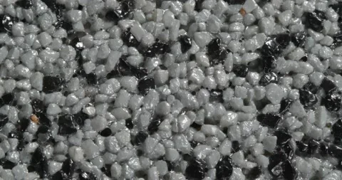 Close-up texture of fine marble chips. Grey and black color. Vidéo 169061884