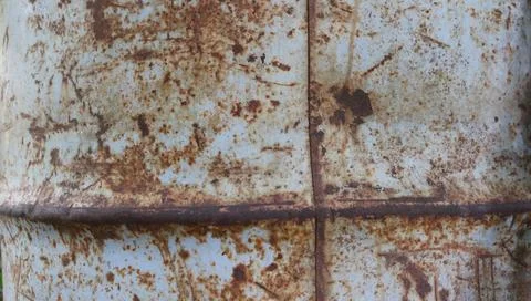 Close-up texture of a fragment of a rusty iron barrel Stock Photos