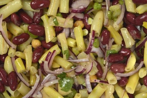 Close up texture of fresh bean salad with kidney beans chickpeas and wax bean Stock Photos