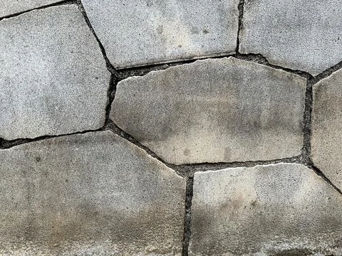 Close-up texture of grey stone pavement wall tiles background for design Stock Photos