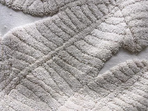 Close-up of texture of grey terry towel. Textile background. Stock Photos