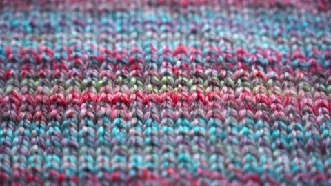 Close-up Texture of Handmade Knitted Clothing with Colorful Yarn Patterns Stock Footage 341389326